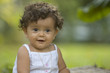 infant in garden playing