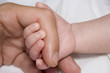baby hand and parent arm