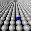 one blue ball amongst many white balls