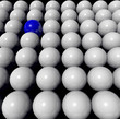 one blue ball amongst many white balls