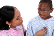nurse checking listening to boy's chest