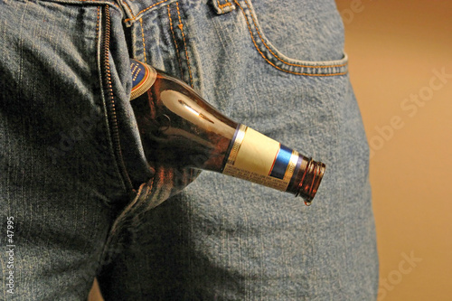 man with beer bottle coming out of pants zipper.