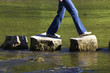 crossing three stepping stones in a river