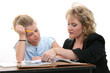 teacher helping student at desk