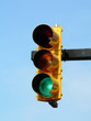 green traffic light against blue sky green traffic light against blue sky