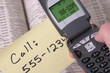 cell phone and phone book and note