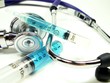 syrings with stethoscope on white