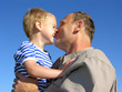 grandfather with grandson kiss by nose