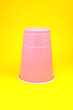 purple cup on a yellow background