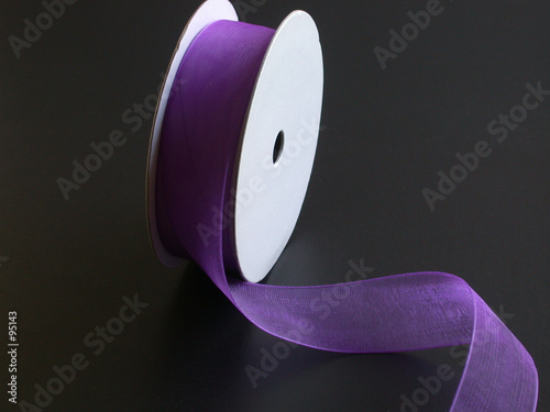 purple ribbon on a black background