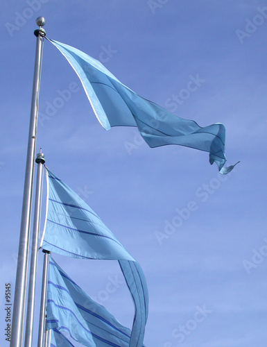 blue flags on a blue sky