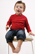 toddler on a  stool