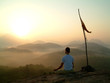 Photo: man meditating at sunrise man meditating at sunrise