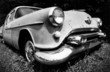 classic antique oldsmobile in black and white