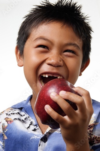 Photo: boy with missing front teeth about to bite an appl boy with missing front teeth about to bite an appl