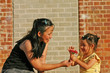 Photo: mother and daughter with a flower mother and daughter with a flower
