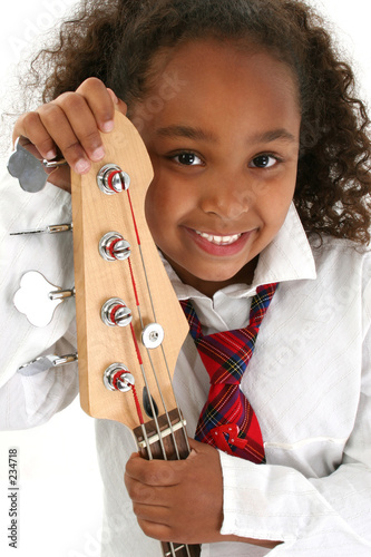 Photo: beautiful young girl with bass guitar beautiful young girl with bass guitar