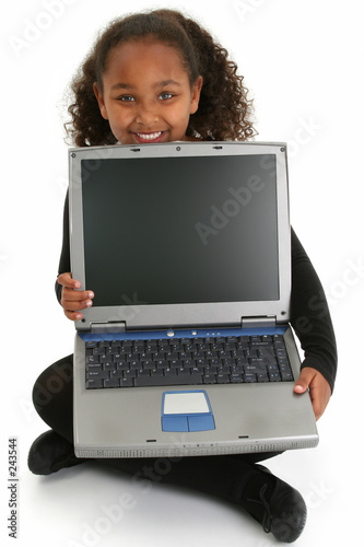 adorablel girl on floor with laptop