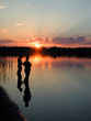 two people evening fishing on the river