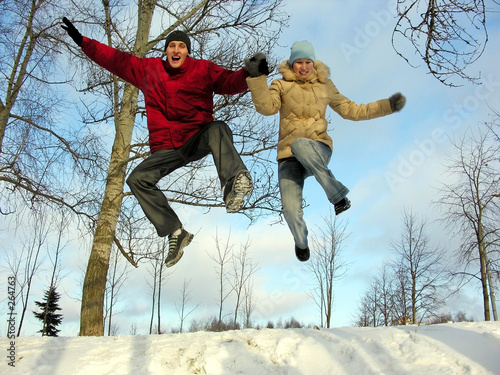 Photo: jumping couple . winter. jumping couple . winter.