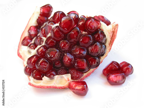 pomegranate seeds on white