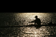 rowing alone at sunset