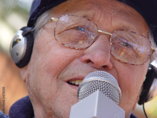 Photo: an old man singing an old man singing
