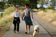 couple walking their dog in the park