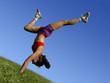 girl exercising outdoors on the grass