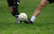 two men playing soccer