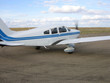 small airplane taxiing down runway