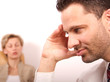 woman with eyes closed, man covers face with hand