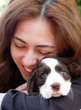 a happy girl holding her dog