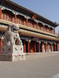 lion in front of chinese building lion in front of chinese building