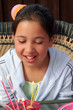 birthday girl looking at candles