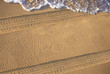 vehicle tracks on the sand