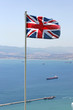british flag flying on top of the rock of gibraltar