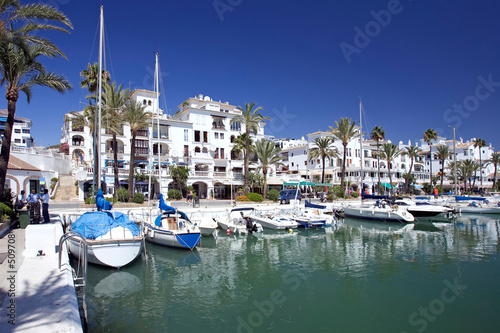 Photo: boats and yachts moored in duquesa port in spain on the costa de boats and yachts moored in duquesa port in spain on the costa de