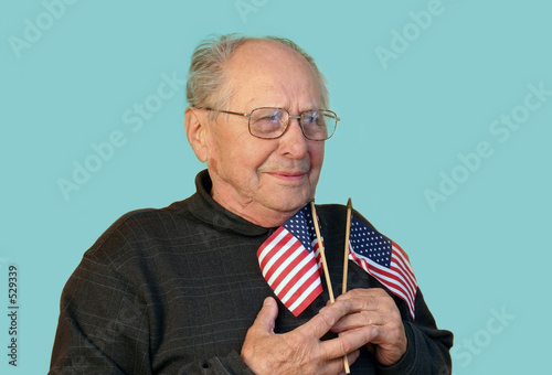 Photo: senior man with american flag isolated senior man with american flag isolated