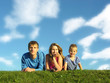 family on herb under blue sky