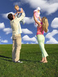 happy family with two children on blue sky with cl
