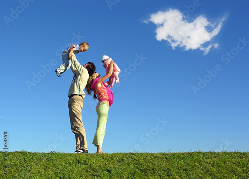 Photo: family with two children and cloud family with two children and cloud