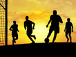 soccer players playing (sunset)