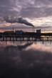 chimney and smoke at sunset
