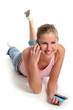 girl lying with credit card and mobile phone