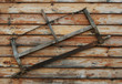 an old saw hangs on the wall
