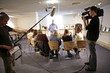 video crew filming meeting with movement blur
