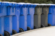 row of garbage cans