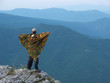 man standing on the edge of the mountain man standing on the edge of the mountain