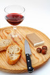 pate, bread, glass of red wine, hazelnuts and knif